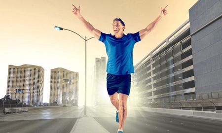one caucasian man young sprinter runner running  winner at finish line  in silhouette studio  on...