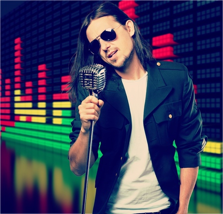 young singer with microphoneの写真素材