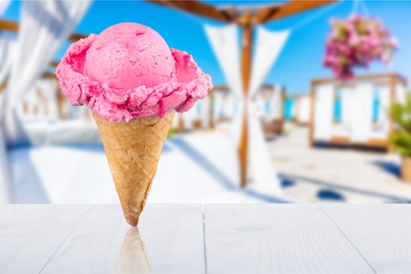 Mixed ice creams in cones on white backgroundの写真素材