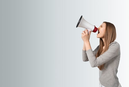 Woman Yelling through a Megaphoneの写真素材