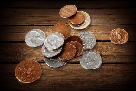 Different kinds of antique roman coins on white background