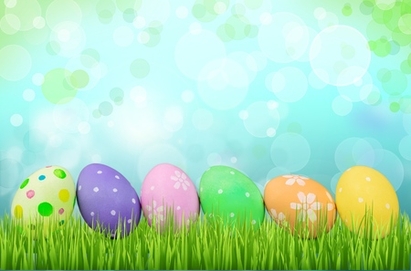 Row of Easter eggs in Fresh Green Grass
