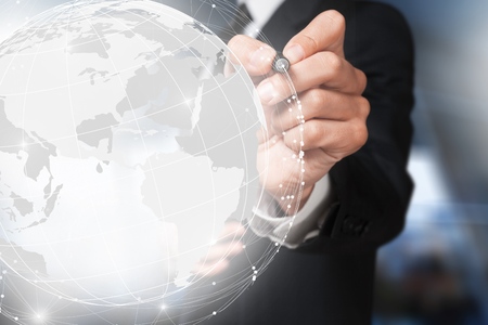 Businessman touching global networkの写真素材