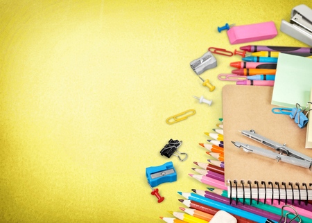Back to school concept on yellow wooden background. Top viewの写真素材