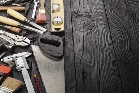 DIY workbench top view with carpentry and construction tools, copy space at topの写真素材