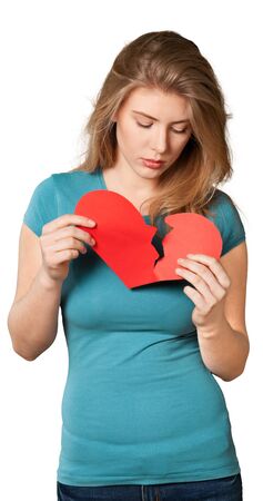 Portrait of girl holding red broken heart symbol on a white background
