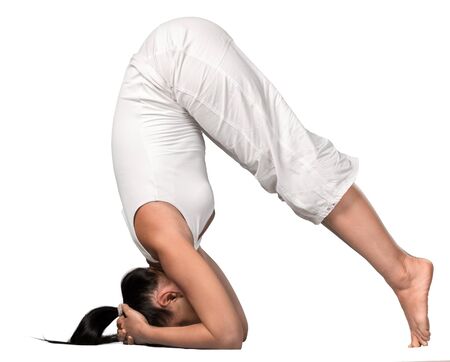 Young woman doing yoga isolated on white