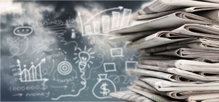 Pile of printed newspapers on backgroundの写真素材