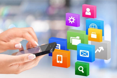 Human hand holding mobile with pay icons