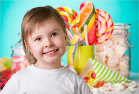 Child and Colorful candiesの写真素材