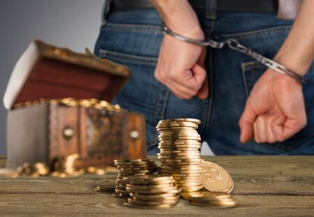 Gold coins man hands close upの写真素材