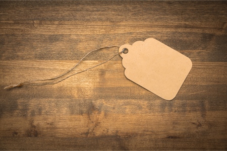 Blank tag tied for hang on product for show price or discount isolate on white background with clipping pathの写真素材