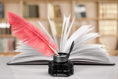 Vintage red quill pen with inkwellの写真素材