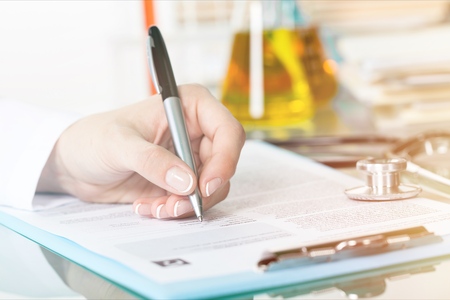 Doctor consulting male patientの写真素材