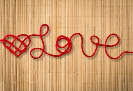 Red rope in heart shapeの写真素材