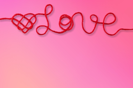 Red rope in love shape knotの写真素材
