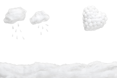 Two small clouds pouring rain over two mushrooms and a white heart, in a heavenly scenery where the clouds  are made from cotton-wool, on a blue sky paper background.の写真素材