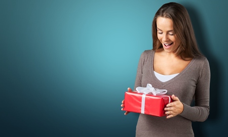 Young girl with gift boxの写真素材
