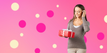 Young girl with gift boxの写真素材