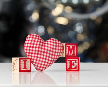 Small red heart on table