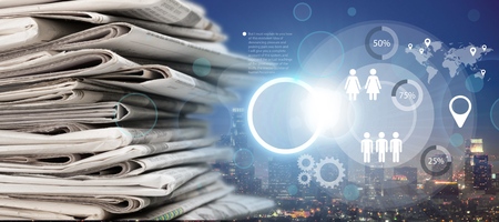 Pile of newspapers on city background