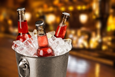 Bottles of cold and fresh beer with ice isolatedの写真素材