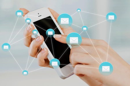 Womens hand holds on mobileの写真素材