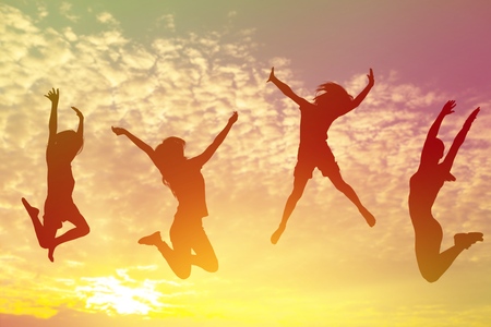 Group people jumping on beach