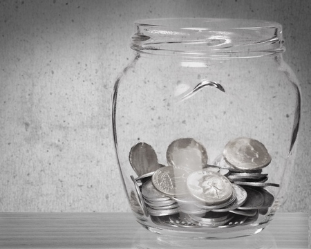 Coin in glass bottle with money stack step up growing growth saving money, Concept financial business investment, Copy space for your textの写真素材
