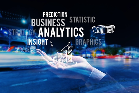 Double exposure hand of professional businessman connected internet and wireless network with his smart phone and city of business background in business trading and technology conceptの写真素材