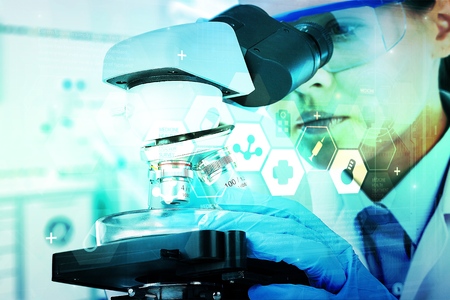 Double exposure of scientist taking aliquote of an enzyme in modern lab, science concept,copy space,mock up,film effect.の写真素材