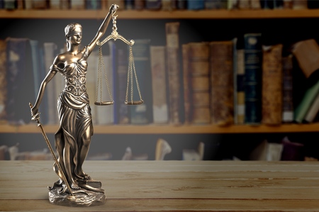 Law theme, mallet of the judge, wooden desk, booksの写真素材