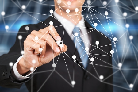 Dot flying network touched by businessman on blurred background