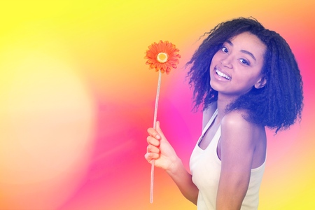 Beauty surprised Young fashion model Girl with Valentine Heart shaped cookie in hand. Love. Beautiful young woman pointing hand, advertising gesture. Valentines Day gift. Pink polka dots background.の写真素材