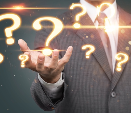 Businessman holding hand drawn question