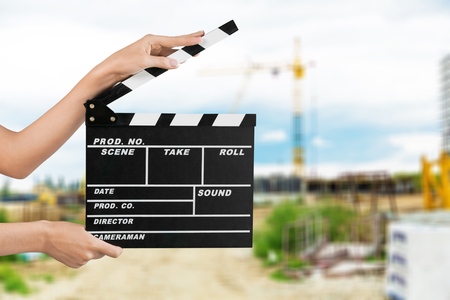 Human hand hands holding clapper board for makingの写真素材