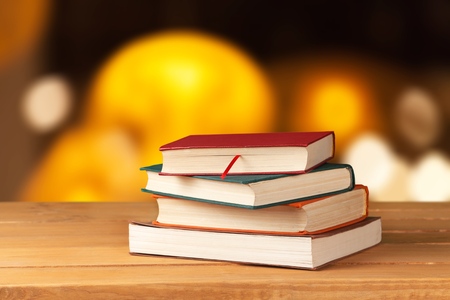 Old books on wooden deck tabletopの写真素材