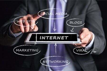 Female hands touching tablet with white cloud conceptの写真素材