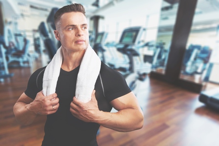 Muscular man drinking protein shake at crossfit gymの写真素材