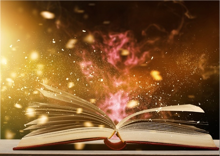 Open book with magic light