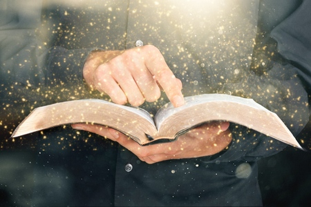 Man holding open bookの写真素材