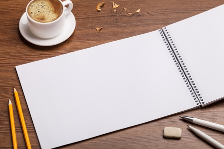 Pen, coffee and blank paper with inscription Introduction. Realistic top view vector illustration....