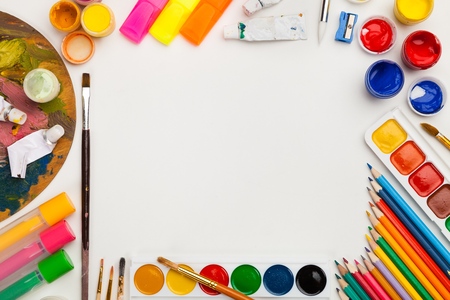 Colorful drawing supplies frame on white background free space, flat lay. Art, workshop, painting, inspiration, craft, creativity conceptの写真素材