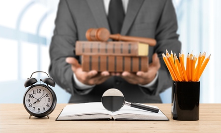 Judge holding Hammer Judge and bookの写真素材