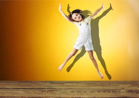 portrait of a happy pretty girl  jumping .の写真素材