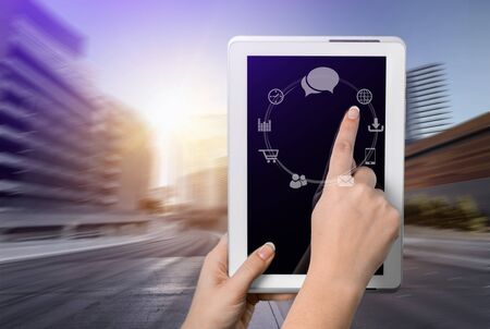 Woman reading horoscopes on tabletの写真素材