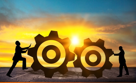 Businessman in teamwork concept with cogwheelsの写真素材