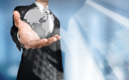 Businessman holding global network and data exchanges over the world 3D renderingの写真素材