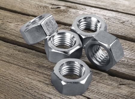 Metal bolts and nuts isolated on white