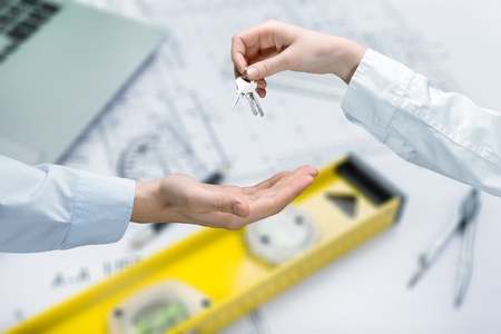 Top view Architect and the engineering contractor shaking hands on building project, tools background.の写真素材
